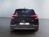 the rear end of a black car in a white room