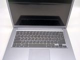 a silver laptop with a black keyboard on a table