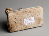 a small purse that has a tag on it
