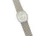 a close up of a watch on a white background with a white background