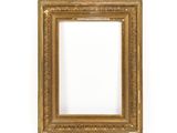 an antique gold frame on a white background