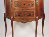 a marble top chest of drawers with a marble top
