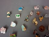 a lot of pins that are on a table