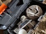 a person holding a tool box with items in it