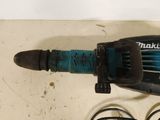 an image of a corded drill on a table