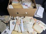 a box full of old letters and envelopes sitting on a table