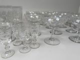 a lot of wine glasses sitting on a table