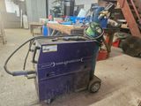 a welding machine that is sitting in the garage