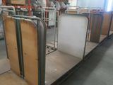 a room filled with lots of metal and wooden furniture