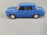 a blue toy car that is sitting on a white surface