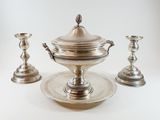 silver plated tea set with two cups and a saucer on a tray