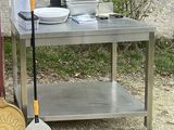 a silver table with a shovel and a bowl on it