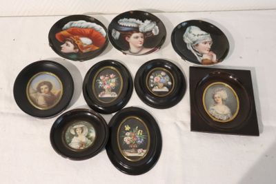nine plates with pictures of women on them sitting on a table