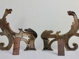 two pieces of wood sitting on a white surface