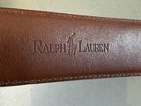 brown leather belt with the name ralph lauren engraved on it