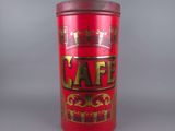 an old red tin canister with the word cafe on it