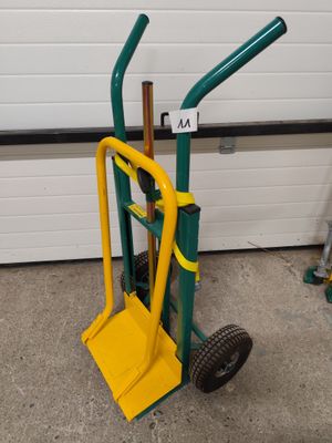 a small hand truck with a yellow handle and a green handle