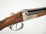 a close up of a rifle with a gun on it