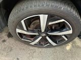 the tire of a car with a flat tire on the ground