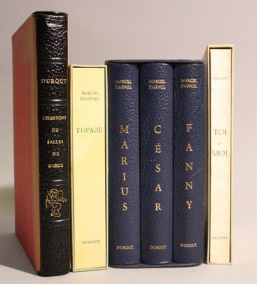 three books sitting on top of each other next to each other