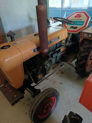 a tractor that is parked in a garage
