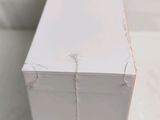 a close up of a white box on a table