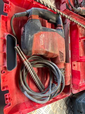 an image of a red tool box with tools in it