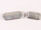 pair of silver plated pill cases with floral designs