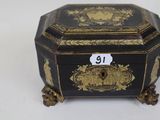 a black and gold box with a number on it