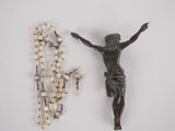 a rosary and a crucifid on a table