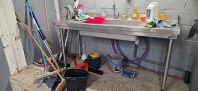 a picture of a kitchen with a sink and a lot of tools