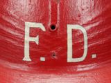 a red fire hydrant with the letters f d painted on it