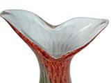 a glass vase with a red and white design on it