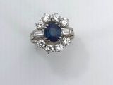 a blue sapphire and diamond ring with baguets