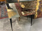 a glass table with a mirror on top of it