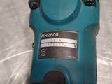 a close up of a blue electric drill on a table