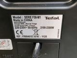 a close up of a small electrical device with a cable