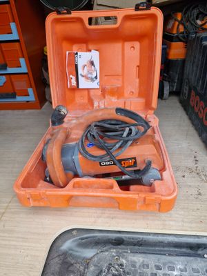 an orange tool box with a cord and a tool in it