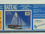 a box of construction tools and a boat on the table