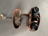 an overhead view of a pair of binoculars on a wall