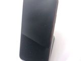 a cell phone that is sitting on top of a stand