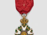 an image of a red ribbon with a gold star on it