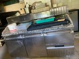 a kitchen with a stove, sink, and dishwasher in it
