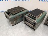 three pieces of metal are sitting on top of a table