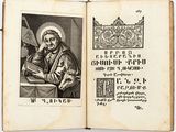 an old book with a picture of a man sitting at a table
