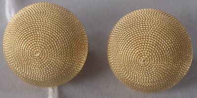 pair of gold tone earrings with a mesh design