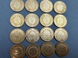 a bunch of coins sitting on top of a blue surface