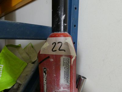 a fire hydrant with a number on it next to a shelf