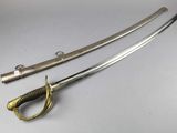 a pair of swords with a gold handle and a black handle