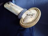 a close up of a belt with a metal object on it